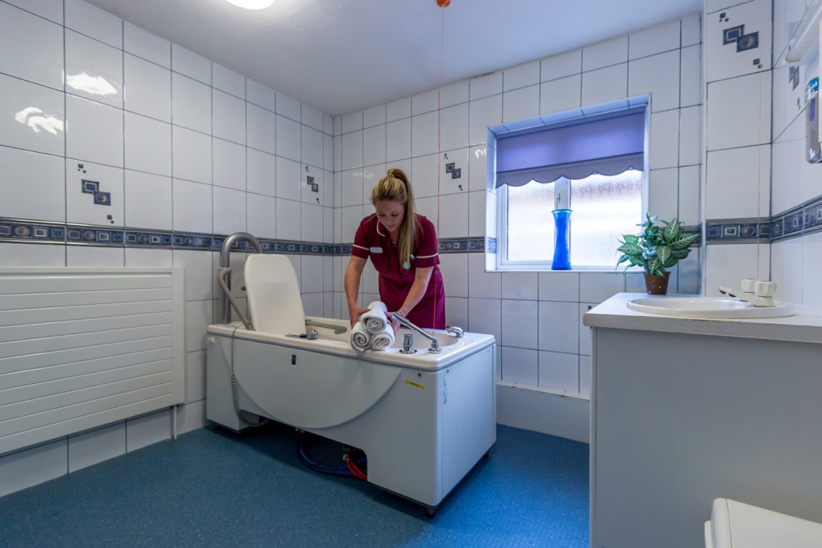 RAYNERS - Carer setting up assisted bathroom